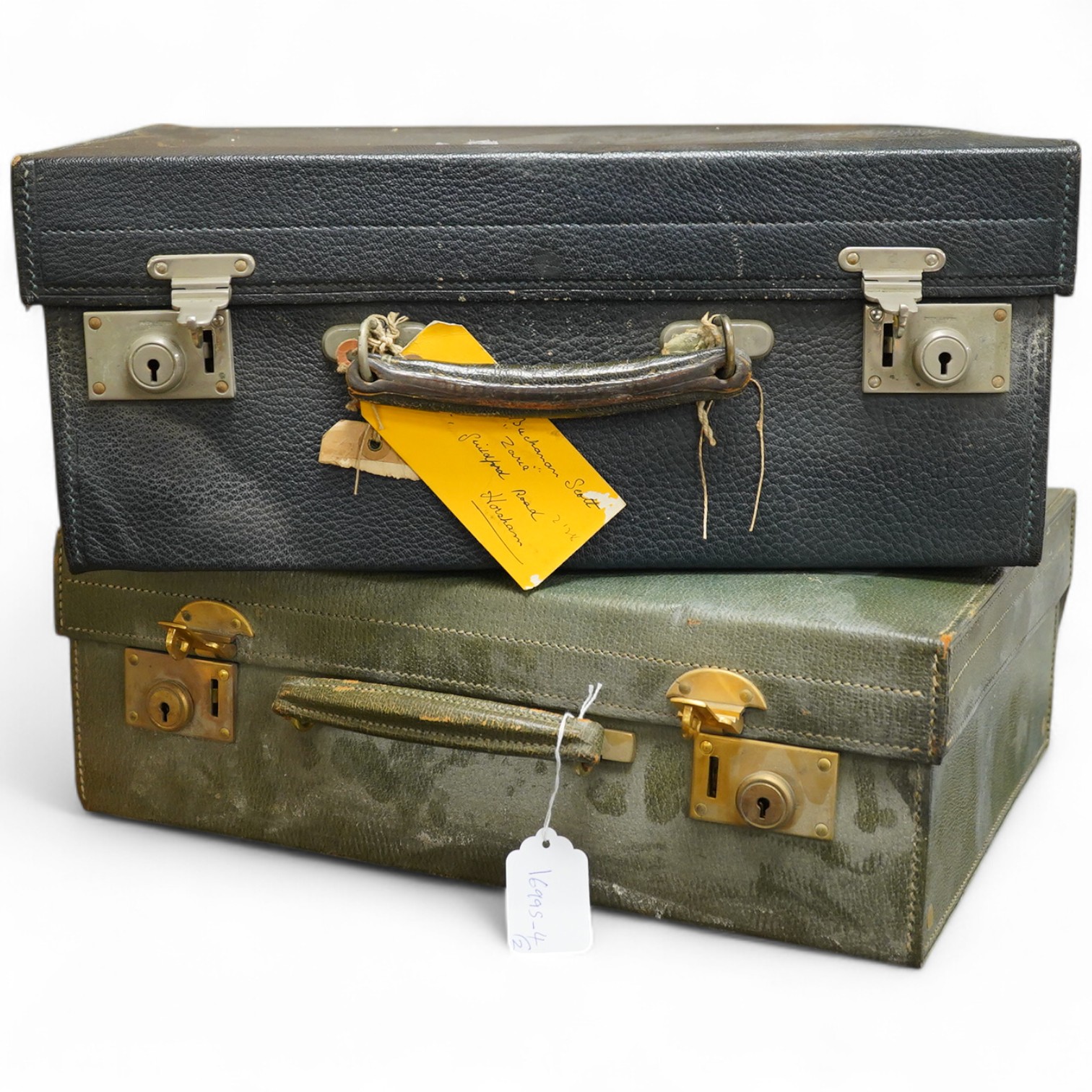 Two fitted travelling vanity cases, one with eight silver mounted toilet jars etc. by Asprey & Co, London, 1938, the other with seventeen silver mounted items, Thomas Jones Watson, London, 1911(incomplete).